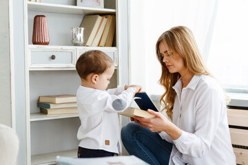 Obraz premium Mom and baby having fun at home