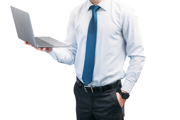 A guy in a tie and shirt holds a laptop with his hand in his pocket..