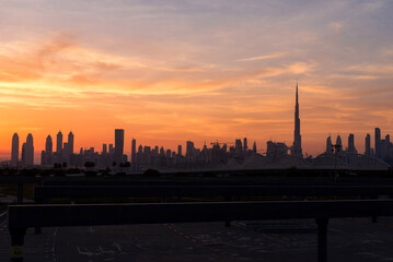 Fototapeta na wymiar Beautiful panoramic view of dubai and burj khalifa at night. Sunset sky.