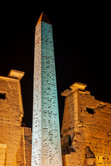 Large obelisk at entrance to Luxor Temple during night
