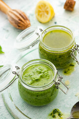 Basil Pesto in Jar. Close Up View. Homemade Healthy Food. Italian Pasta Recipe