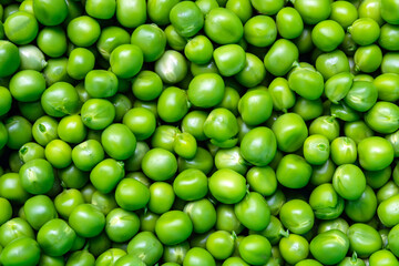 background of fresh, young, peeled green peas