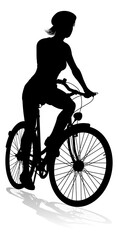 Obraz premium Bicyclist riding their bike and wearing a safety helmet in silhouette