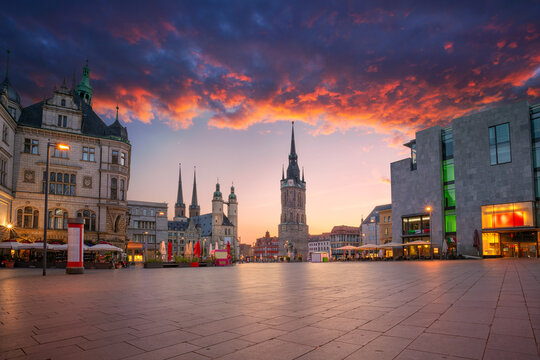 Halle, Germany. Cityscape image of historical downtown of Halle (Saale) with the Red Tower and the Market Place during dramatic sunset.