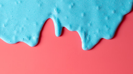 Blue slime isolated on pink background