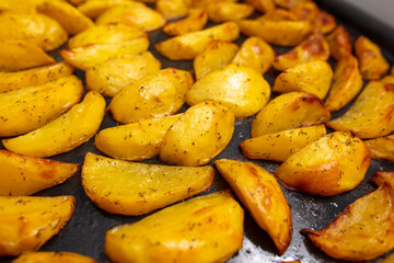 Baked potatoes in the oven as a background.