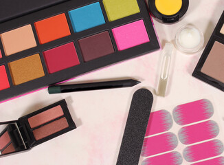 Colorful Cosmetic Palettes on paper background