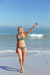 Beautiful woman enjoying on the beach