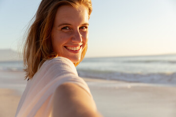 Portrait of beautiful woman smiling on the beach