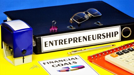 Entrepreneurship-text inscription on the office Registrar's folder with documents. Financial profit strategy diagram, successful work plan, long-term goals, market overview.