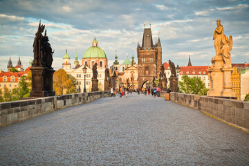 Naklejka premium View of the Old town of Prague from Charles bridge with its sculptures and the Old town tower. Locals only due to pandemic lockdown