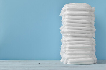 A stack, a pile of clean, modern dry linen or a diaper with copy space.