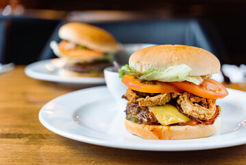 tasty burger with sauce in cafe