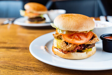 tasty burger with sauce in cafe