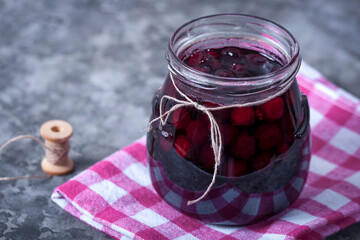 Cherry jam for breakfast. Cooking jam in the summer season. Cooking, preserving berries.