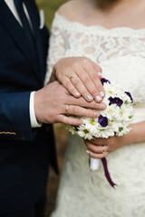 wedding day, hands with wedding rings, wedding rings, bride and groom, the bride's bouquet