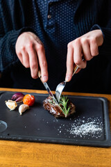 man eating steak in cafe