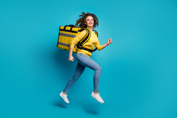 Fototapeta na wymiar Profile side full length body size view of nice attractive cheerful glad wavy-haired girl jumping carrying package running working part-time isolated bright vivid shine vibrant blue color background