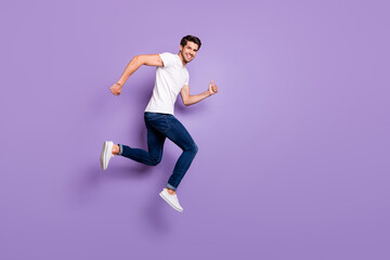 Full length body size view of his he nice attractive cheerful cheery sportive guy jumping running...