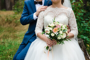 bride and groom, wedding day, bride holds a bouquet, the bride's bouquet, 