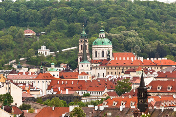 Saint Nicholas church of Prague and Petrin hill seen from Letna, Prague on a rainy day