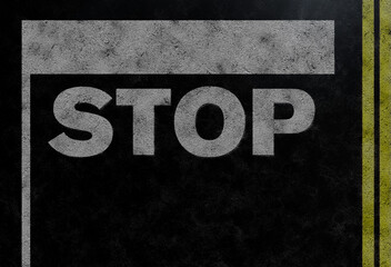 above view of word STOP and stop bar on asphalt road