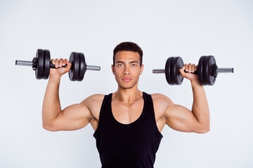 Close-up portrait of his he nice attractive sportive content serious macho guy doing exercise lifting dumbbell effort isolated over light gray pastel color background