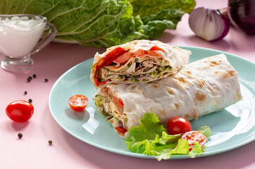 Shawarma with chicken and vegetables on a plate