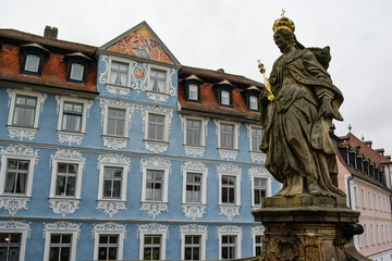 Statue of St. Kunigunde of Luxembourg on Untere Brucke bridge over river Regnitz, Bamberg, Germany. November 2014