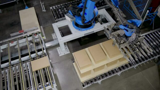 Furniture manufacturing. Furniture parts are packaged on an automated packaging line. 4K