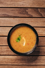 flat lay of cream vegetable soups on wooden table