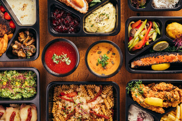group of food in plastic dish on table. take away food