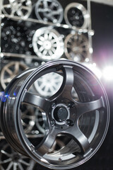 Wheel disks closeup, sale of disks in the showroom. Chrome wheels modern exclusive design..