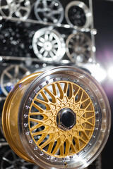 Wheel disks closeup, sale of disks in the showroom. Chrome wheels modern exclusive design..