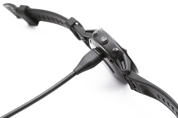 Smart watch charge concept. Charging fitness tracker isolated on white background