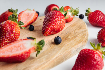 Close-up of strawberries and blueberries on a wooden Board. Fresh berries