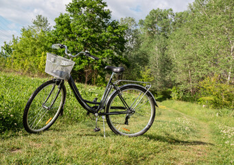 Fototapeta na wymiar Bicycle on a field road on a clear day