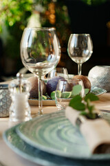 Luxury green table setting decorated with candles