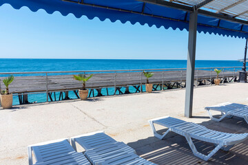 sun loungers and a shadow zone on the beach