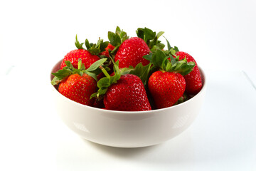 A bowl with strawberries isolated on white background