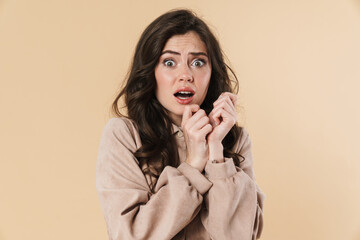 Image of scared shocked nice woman posing and looking at camera