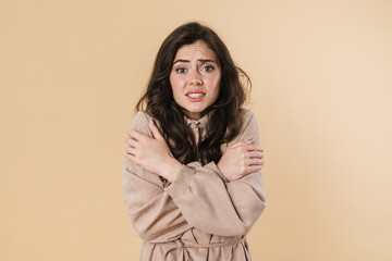 Image of unhappy brunette nice woman trembling and filling cold