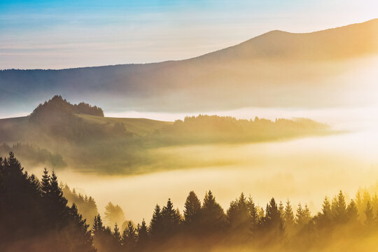 Mountain foggy landscape in an autumn sunrise. The Orava region near the village of Zazriva in Slovakia, Europe.