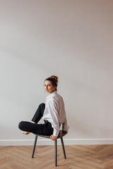 Portrait of a girl sitting on a chair