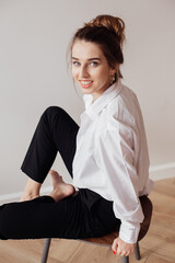 Portrait of a girl sitting on a chair