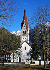 Fototapeta na wymiar Italy, Trentino Alto Adige, Bolzano, San Candido, view of the Aurino River with the small church dedicated to the Holy Spirit