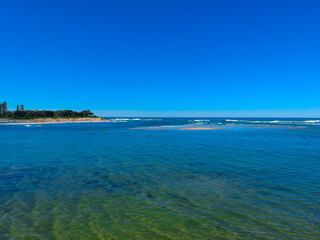 Fototapeta na wymiar Drone Aerial view of The Entrance NSW Australia blue bay waters great beach and sandy bars
