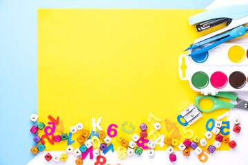 Fototapeta premium Many different school supplies on yellow copy space background. Back to school concept.