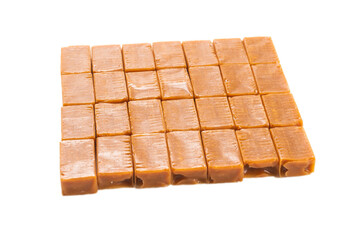 Tasty caramel candy isolated on white background.