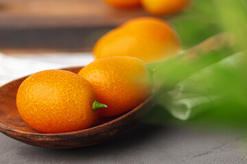 Heap of kumquat fruit on kitchen table
